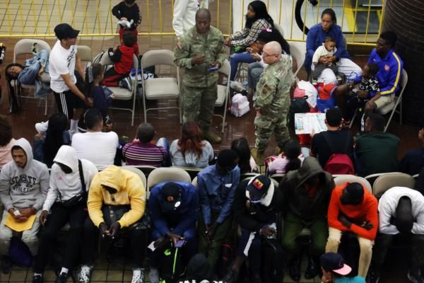 Newly arrived illegal immigrants wait in a holding area at the Port Authority bus terminal before being sent off to area shelters and hotels in New York City on May 15, 2023. (Spencer Platt/Getty Images)