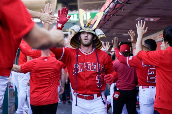 Los Angeles Angels' Taylor Ward celebrates in the dugout after hitting a home run during the first inning of a baseball game against the New York Yankees in Anaheim, Calif., on July 19, 2023. (Ashley Landis/AP Photo)