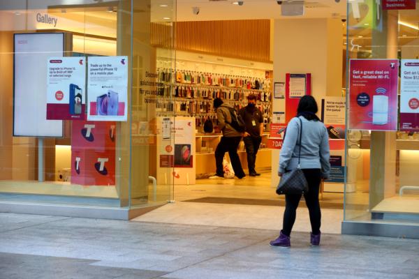 Telstra shop in Rundle Mall services a customer in Adelaide, Australia, on July 21, 2021. (Kelly Barnes/Getty Images)