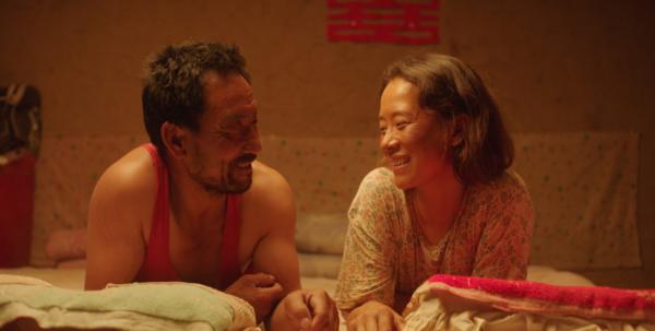 Ma Youtie (Wu Renlin) and Cao Guiying (Hai Qing) learn to care about each other, in "Return to Dust." (Hucheng No.7 Films)