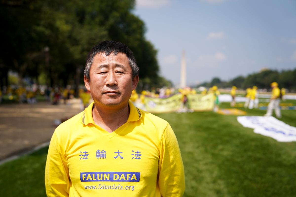 Liang Guiyu, a Falun Gong adherent from Flushing, New York, at the National Mall in Washington, on July 20, 2023. (Madalina Vasiliu/The Epoch Times)