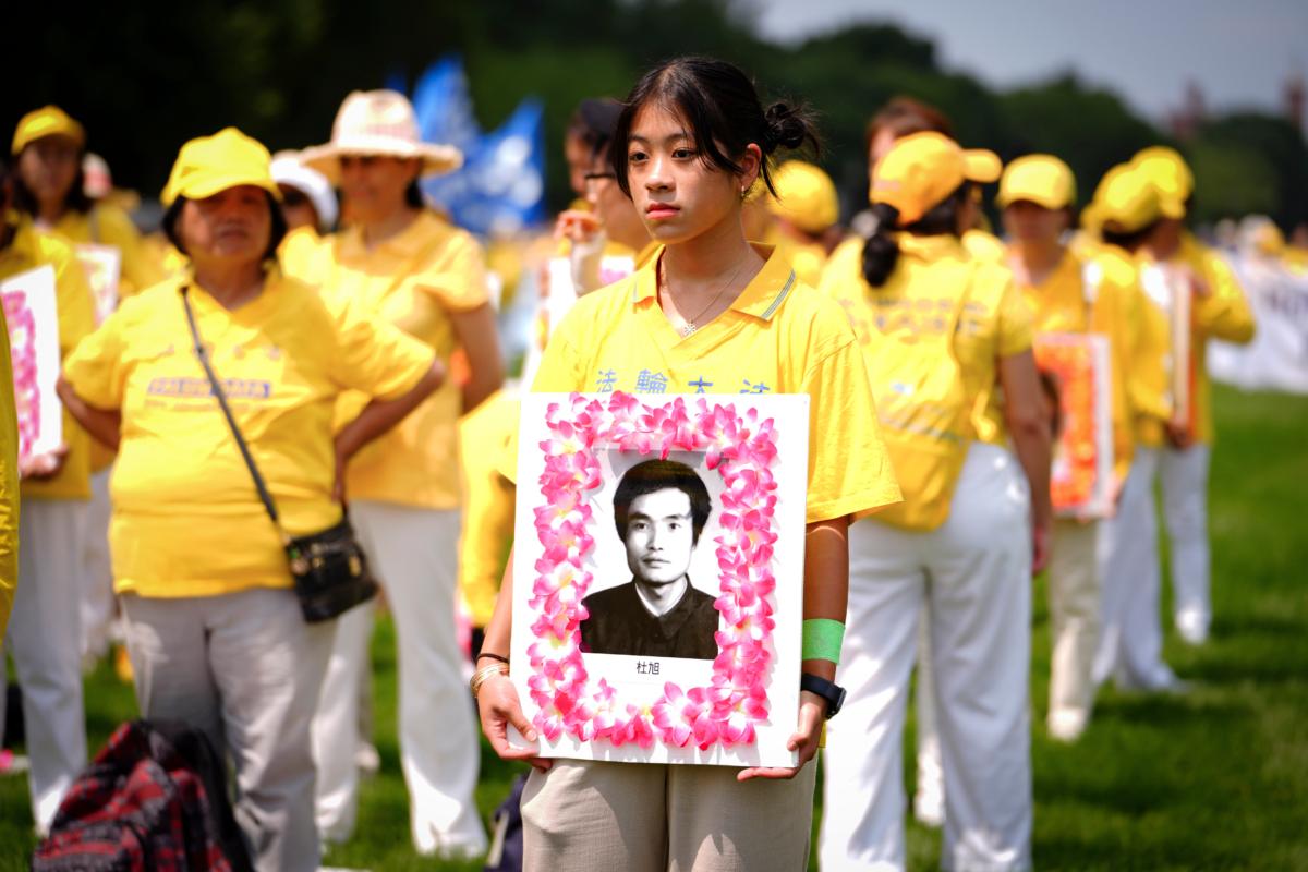  Falun Gong practitioners take part in a parade to mark the 24th anniversary of the persecution of the spiritual discipline in China by the Chinese Communist Party in Washington on July 20, 2023. (Madalina Vasiliu/The Epoch Times)