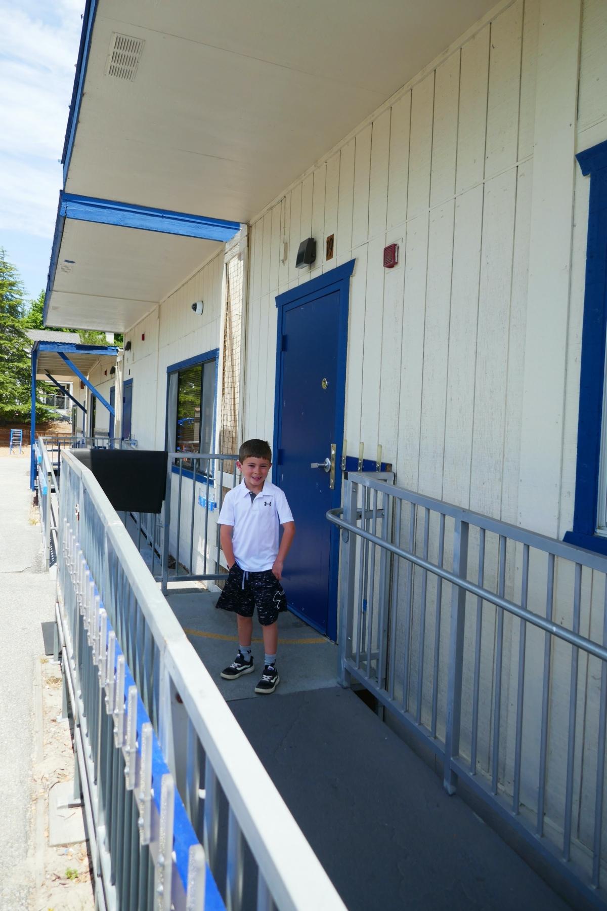  H.N. in front of his first-grade classroom at Brook Knoll Elementary School in Scotts Valley, Calif., on July 16, 2023. (Steve Ispas/The Epoch Times)