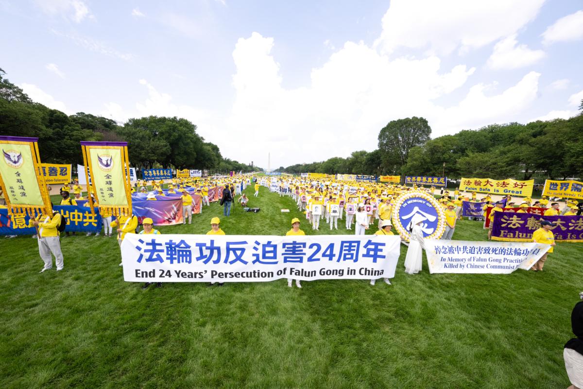 Falun Gong adherents take part in a rally to mark the 24th anniversary of the Chinese regime's persecution of the spiritual discipline, at the National Mall in Washington on July 20, 2023. (Larry Dye/The Epoch Times)
