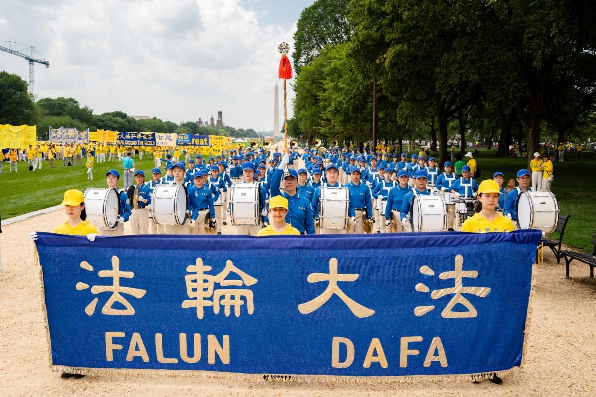 Falun Gong adherents march to mark the 24th anniversary of the Chinese regime's persecution of the spiritual discipline, in Washington on July 20, 2023. (Samira Bouaou/The Epoch Times)