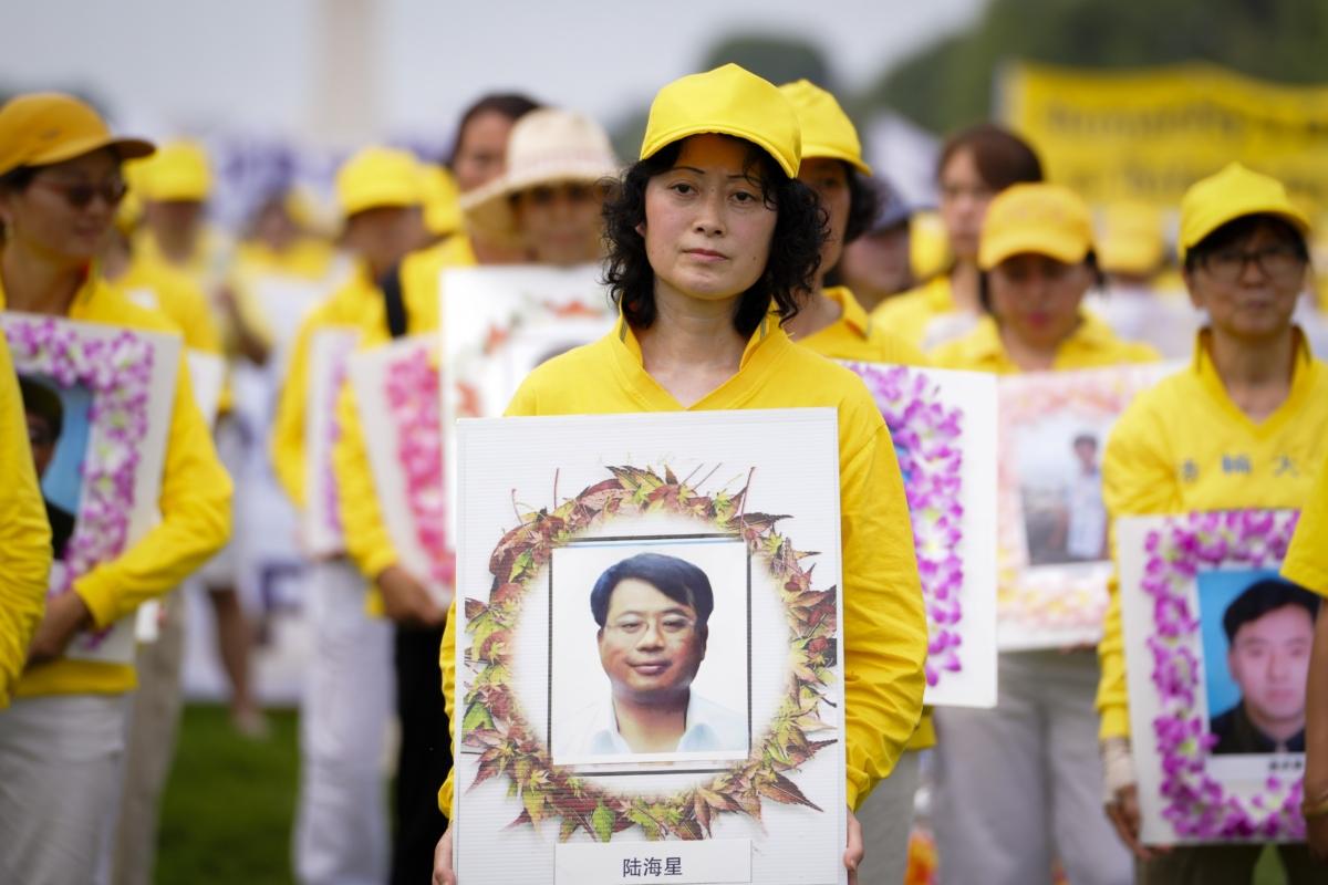 Falun Gong adherents take part in a rally to mark the 24th anniversary of the persecution of the spiritual discipline in China, in Washington on July 20, 2023. (Madalina Vasiliu/The Epoch Times)