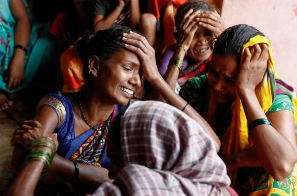Women mourn the death of their relatives, after a landslide hit a village in Raigad, in the western Indian state of Maharashtra, India, on July 20, 2023. (Francis Mascarenhas/Reuters)