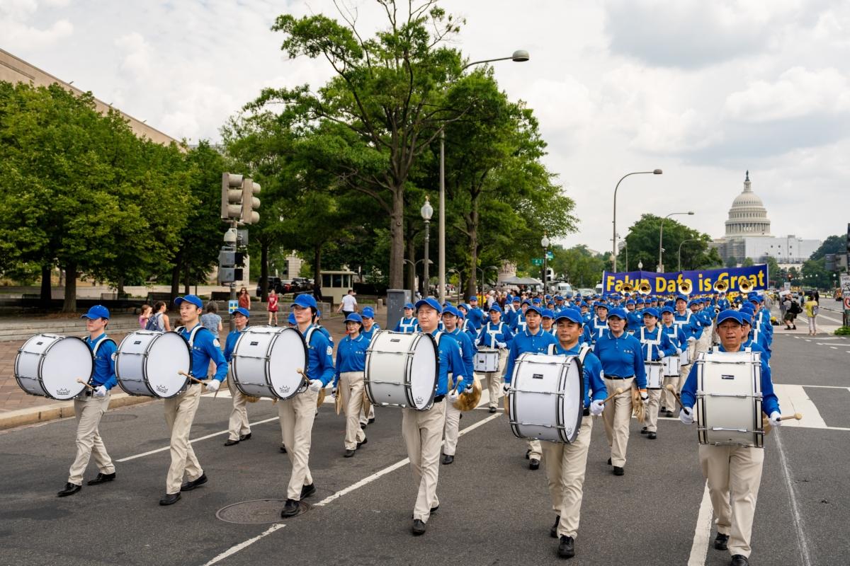 Falun Gong adherents march to mark the 24th anniversary of the Chinese regime's persecution of the spiritual discipline, in Washington on July 20, 2023. (Samira Bouaou/The Epoch Times)