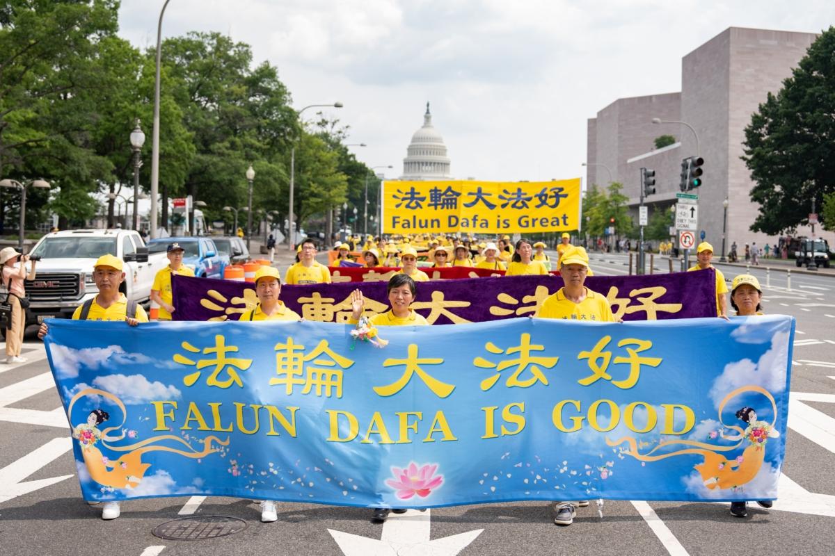 Falun Gong adherents march to mark the 24th anniversary of the Chinese regime's persecution of the spiritual discipline, in Washington on July 20, 2023. (Samira Bouaou/The Epoch Times)