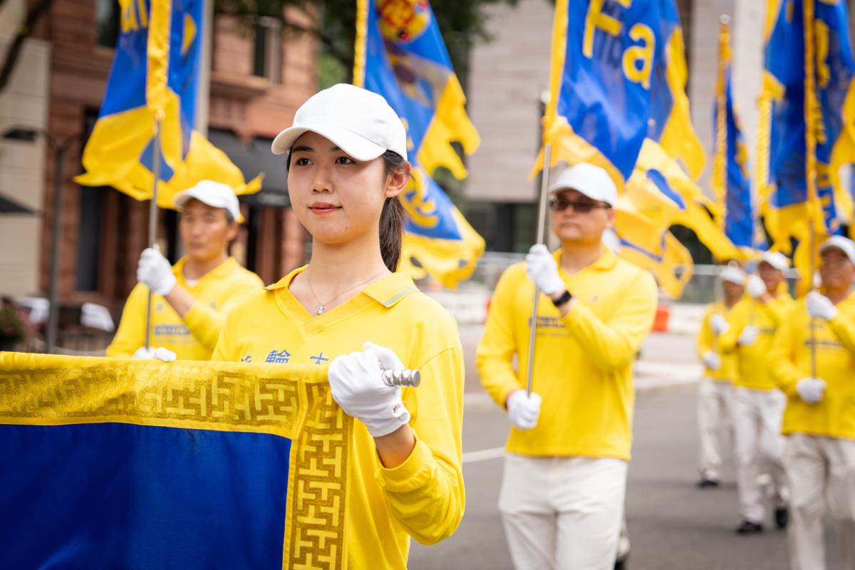 Falun Gong adherents march to mark the 24th anniversary of the Chinese regime's persecution of the spiritual discipline, in Washington on July 20, 2023. (Samira Bouaou/The Epoch Times)