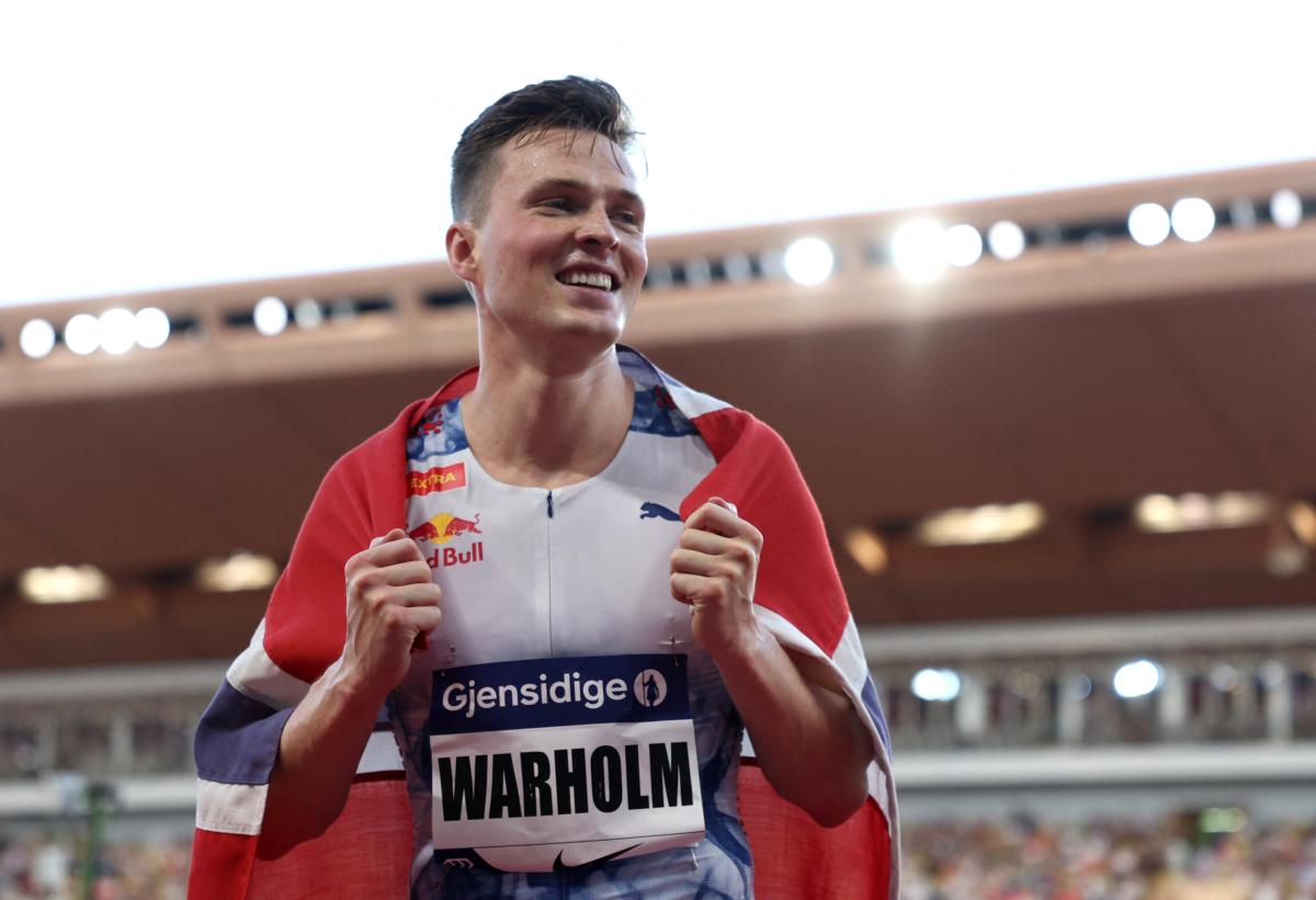 Norway's Karsten Warholm celebrates after winning the men's 400 meters hurdles final during Diamond League at Stade Louis II in Monaco on July 21, 2023. (Claudia Greco/Reuters)