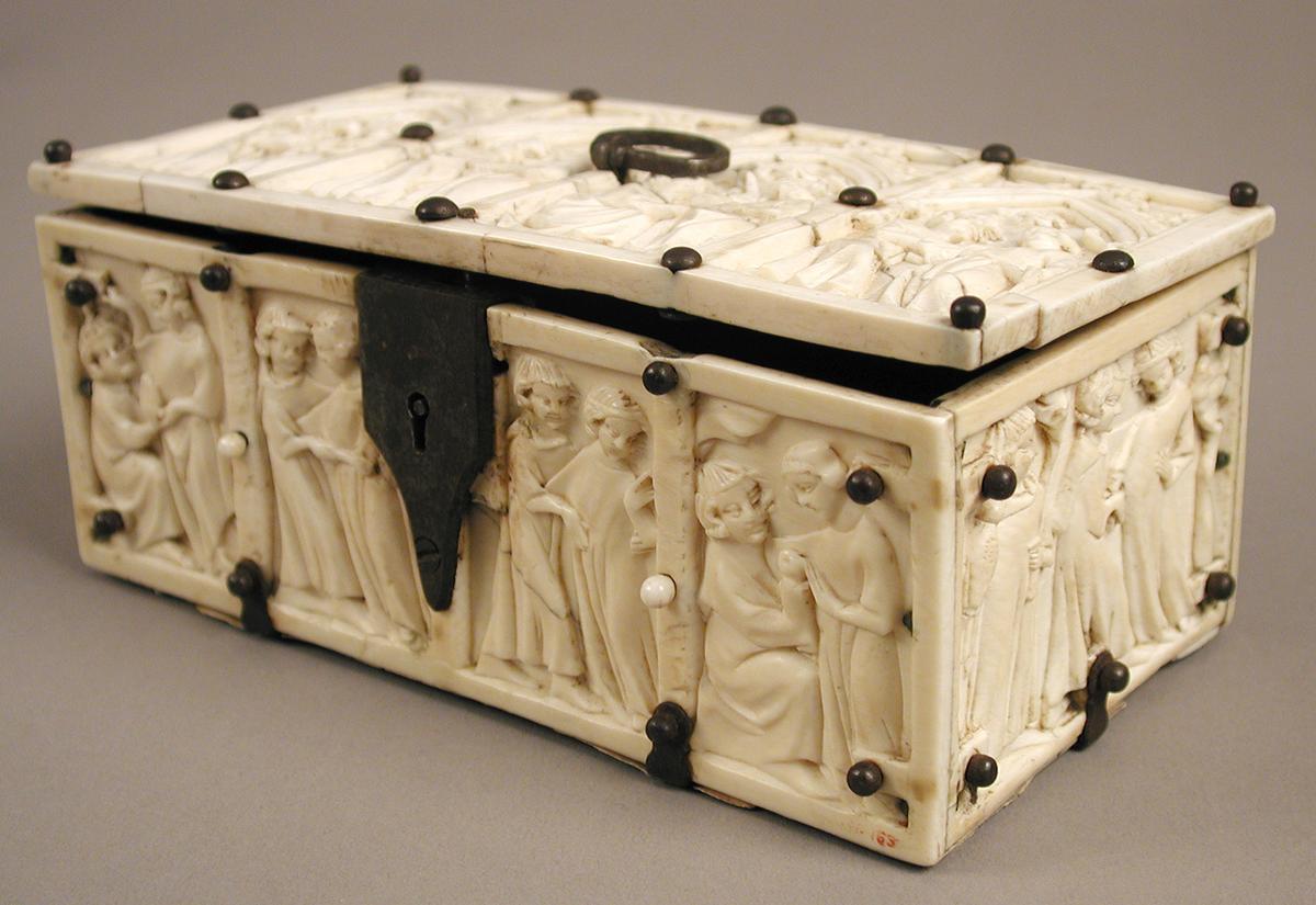 "Box With Courting Couples," 14th century. Elephant ivory with modern iron and cardboard mounts; 2.75 inches by 6.1 inches by 3.6 inches. The Metropolitan Museum of Art, New York. (Public Domain)