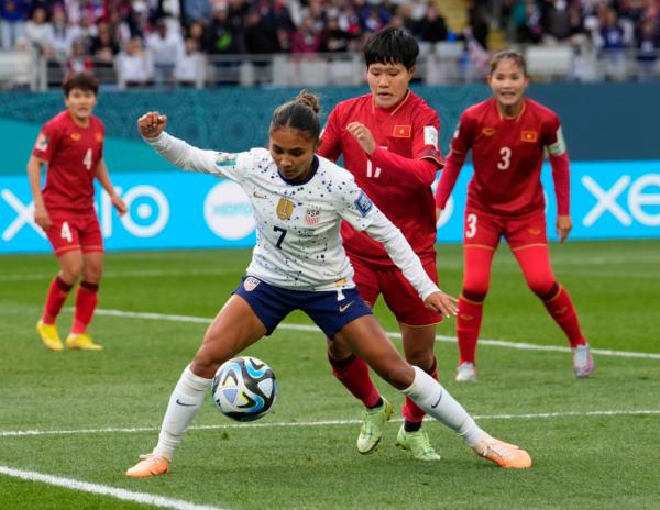 United States' Alyssa Thompson (7) shields the ball from Vietnam's Thi Thu Thao Tran during the Women's World Cup Group E soccer match between the United States and Vietnam at Eden Park in Auckland, New Zealand on July 22, 2023. (Abbie Parr/AP Photo)