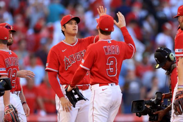 Taylor Ward (3) and Shohei Ohtani (17) of the Los Angeles Angels celebrate after defeating the New York Yankees 7–3 in a game at Angel Stadium of Anaheim on July 19, 2023 in Anaheim, Calif., (Sean M. Haffey/Getty Images)