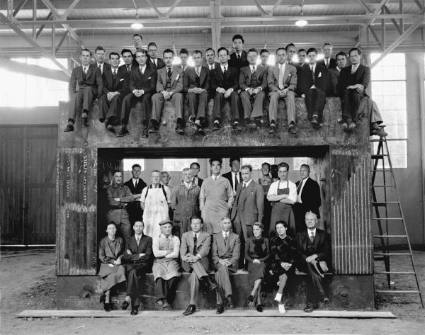 Lawrence Berkeley Laboratory's scientific and technical staff around the magnet of the 60-inch cyclotron. LBL NEWS Magazine, Vol. 4, No. 3, Fall 1979, p. 37. Physics Morgue 1944-51 (P-4) Aug. 1938. (Public Domain)
