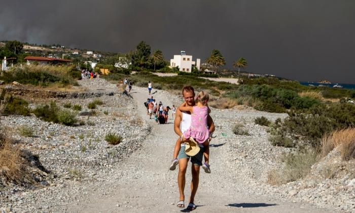 Tourists Flee Wildfires on Greek Island of Rhodes