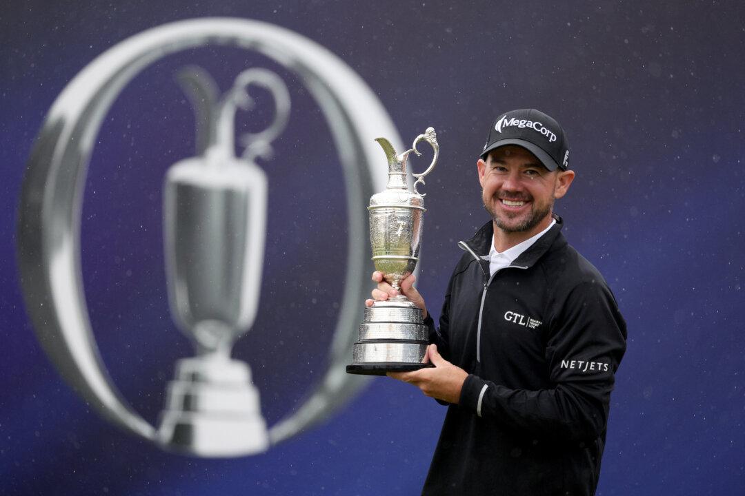 Romp in the Rain as American Harman Wins British Open