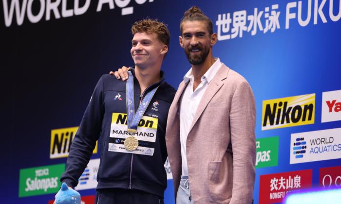 French Torpedo Marchand Smashes Phelps's 15-year Record at Worlds