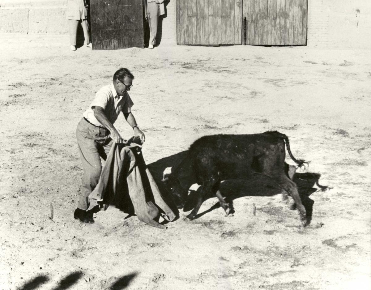 Cooper in the ring with a bull in Pamplona, Spain. (Courtesy of Maria Cooper Janis)