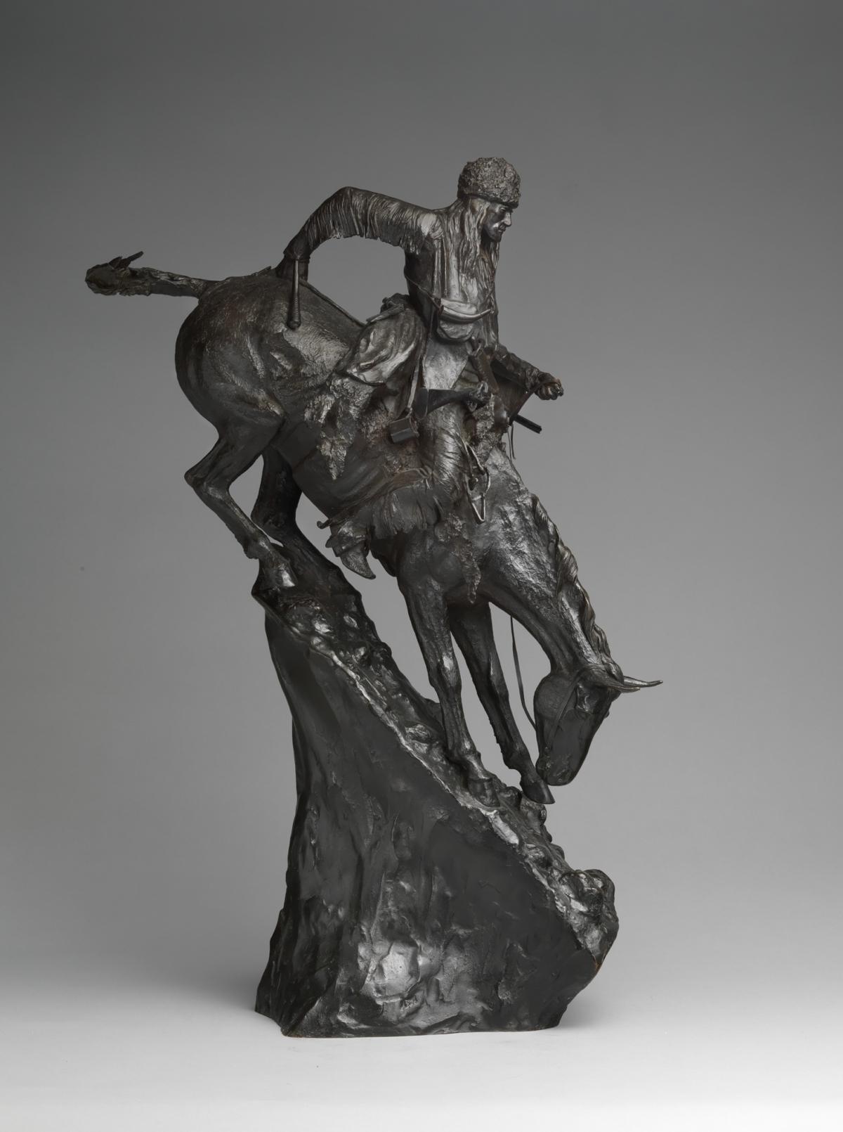 The bronze sculpture “The Mountain Man” by Frederic Remington, designed in 1903,<br/>depicts a buckskin-clad trapper descending a precarious mountain. (Public Domain)