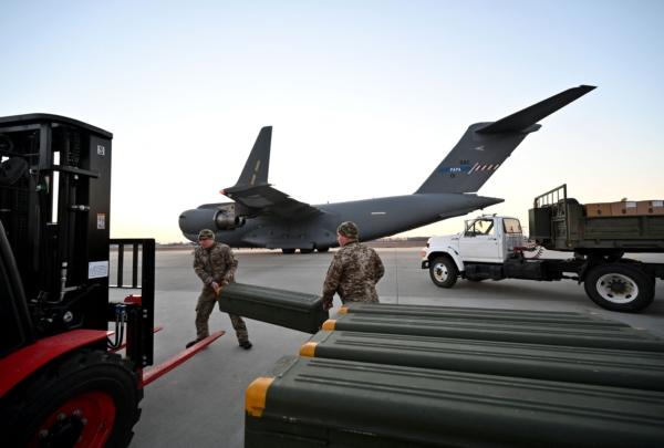 Ukrainian soldiers move U.S.-made FIM-92 Stinger missiles and other equipment shipped from Lithuania to Boryspil Airport in Boryspil, Ukraine, Feb. 13, 2022. (Sergei Supinsky/AFP via Getty Images)