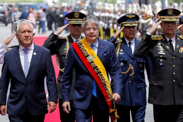 Ecuadorian President Guillermo Lasso walks on the day of his annual report to the nation, a week after dissolving the National Assembly and calling for early elections in Quito, Ecuador, on May 24, 2023. (Karen Toro/Reuters)