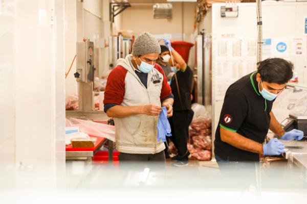 Workers are seen in a butcher shop in Lakemba in Sydney, Australia, on July 22, 2021. (Jenny Evans/Getty Images)