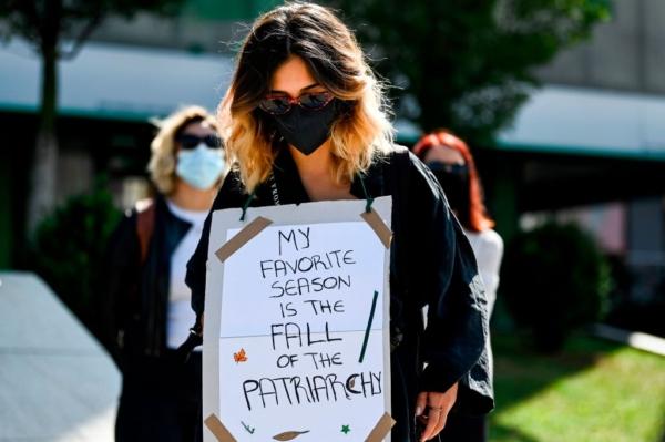 A woman holds a placard during a protest against gender violence and patriarchy in Pristina, Kosovo, on Sept. 23, 2020. (Armend Nimani/AFP via Getty Images)
