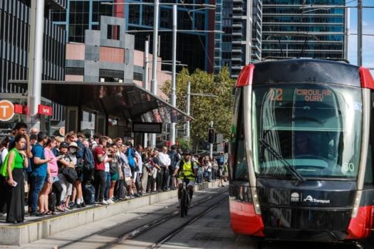 Commuters wait for light rail service at Town Hall Station in Sydney, Australia on March 8, 2023. (Roni Bintang/Getty Images)