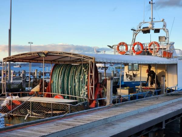 A fisherman can be seen onboard a vessel at Emu Point in Albany, Western Australia, on July 26, 2023. (Susan Mortimer/The Epoch Times)