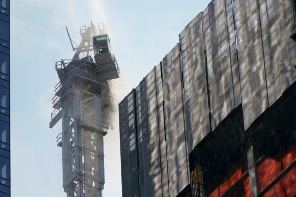 Smoke rises from a construction crane that caught fire in Manhattan, N.Y., on July 26, 2023. (Seth Wenig/AP Photo)
