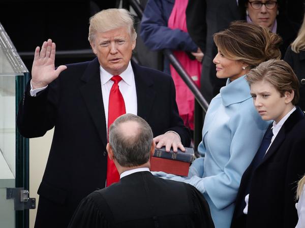 Supreme Court Justice John Roberts (2L) administers the oath of office to U.S. President Donald Trump as his wife, Melania Trump, holds the Bible and son Barron Trump looks on, at the U.S. Capitol in Washington on Jan. 20, 2017. (Drew Angerer/Getty Images)