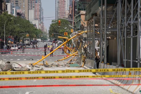 The aftermath of a crane catches fire and collapses in the early morning near 41st and 10th avenue in New York City on July 26, 2023. (Chung I Ho/The Epoch Times)