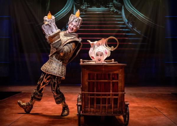 Lumiere (Christopher Kale Jones, L) and Chip (Layla Joan), in Disney’s “Beauty and the Beast.” (Liz Lauren)