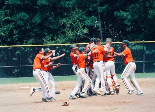 The Olive Pony Baseball’s 11-and-under team celebrating after winning the World Series championship in Chesterfield, Va., on July 24, 2023. (Courtesy of Greg Cicero)