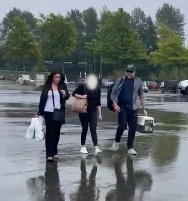 Eileen Marx (L) and Victor Marx (R) escort a sex trafficking victim to the waiting plane to get her out of the country on July 25, 2023. (Courtesy of Victor Marx)