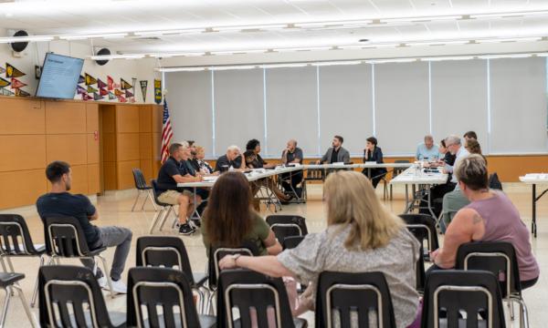 Port Jervis Downtown Revitalization Initiative Local Planning Committee members discussed projects submitted during a meeting in Port Jervis, N.Y., on July 27, 2023. (Cara Ding/The Epoch Times)