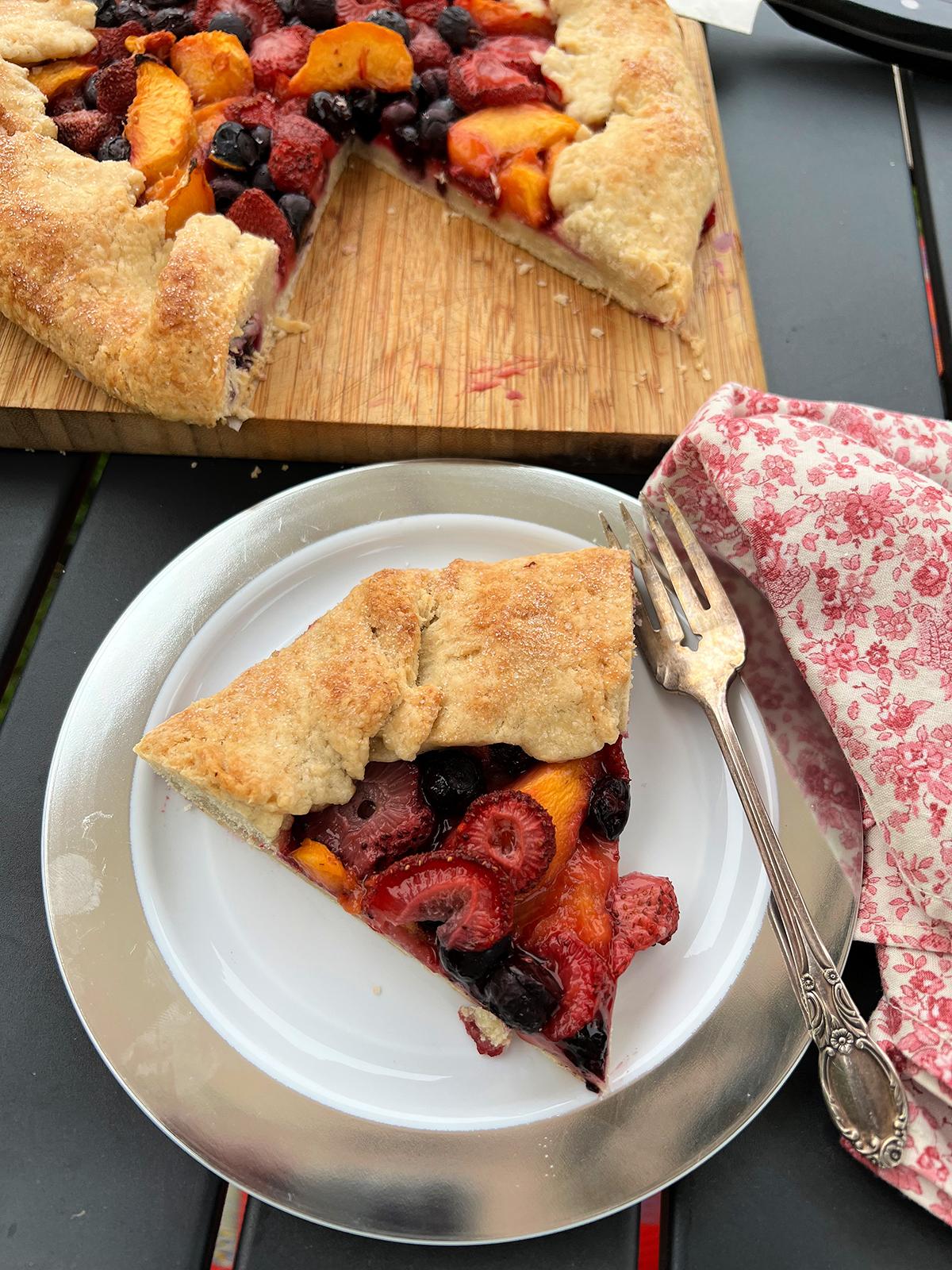 A slice of peach, strawberry, and blueberry galette for dessert speaks to the season. (Gretchen McKay/Pittsburgh Post-Gazette/TNS)