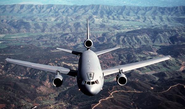 A 79th Air Refueling Squadron KC-10A Extender aircraft flies over a mountain range near Travis Air Force Base. (USAF)