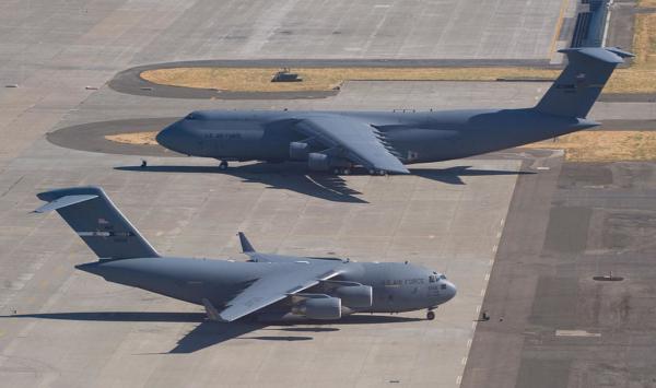 A U.S. Air Force C-5 Galaxy and a C-17 Globemaster sit on the tarmac at Travis Air Force Base in Fairfield, Calif., on July 17, 2008. (Saul Loeb/AFP via Getty Images)