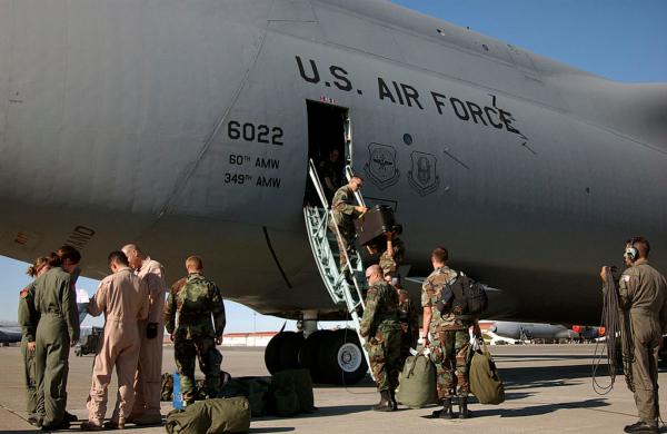 In this handout from the U.S. Air Force, personnel with the 60th Air Mobility Wing prepare to leave Travis Air Force Base on an emergency rescue mission to the Pacific coast of Russia in Fairfield, Calif., on Aug. 5, 2005. (David W. Cushman/U.S. Air Force via Getty Images)