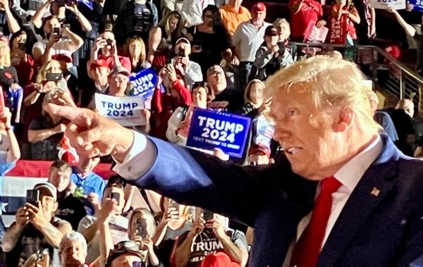 Former President Donald Trump points into the audience during a 2024 presidential campaign rally at Erie Insurance Arena in Erie, Pa., on July 29, 2023. (Janice Hisle/The Epoch Times)