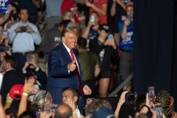 Former President and 2024 presidential hopeful Donald Trump gives a thumbs up as he leaves after speaking at a campaign rally in Erie, Pa., on July 29, 2023. (Joed Viera/AFP via Getty Images)
