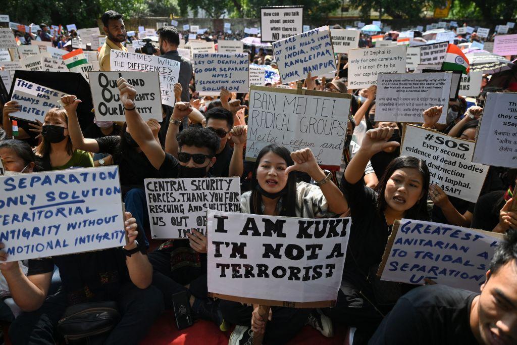 Activists from the All Tribal Students Union Manipur (ATSUM) hold placards during a protest amid ongoing ethnic violence in Manipur, in New Delhi, on May 31, 2023. (Arun Sankar/AFP via Getty Images)