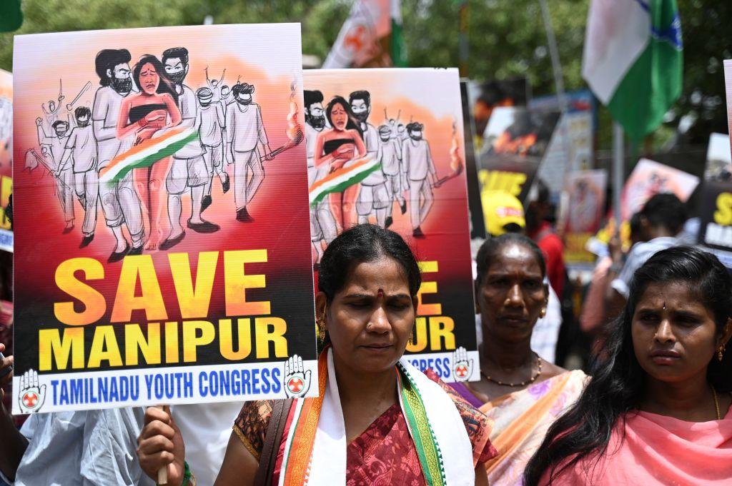 Activists of the Tamil Nadu Youth Congress take part in a demonstration against ongoing ethnic violence in India's north-eastern state of Manipur, in Chennai on July 21, 2023. India's Prime Minister Narendra Modi said on July 20 that the country has been "shamed" by a video showing a mob parading two women naked in a northeastern state where ethnic violence has claimed many lives. (R.Satish Babu/AFP via Getty Images)