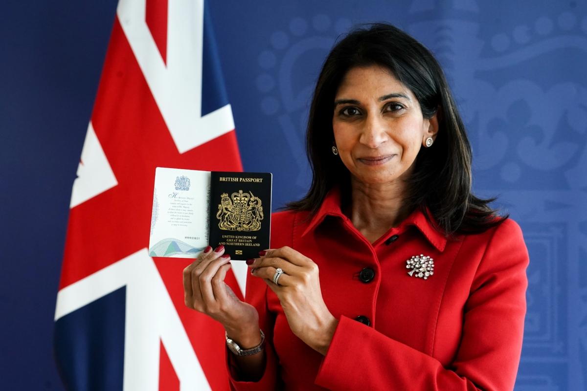 Home Secretary Suella Braverman with the new King Charles III UK passport, at the Home Office, central London, on July 18, 2023. (Jordan Pettitt/PA)