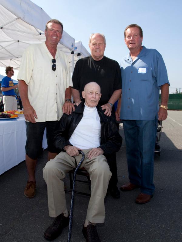 Fullerton College's former longtime Coach Hal Sherbeck (front) poses for a group photo at a 2010 ceremony at the college in Fullerton, Calif. He is surrounded by (L-R) former San Jose State and NFL quarterback Steve DeBerg, who played for Sherbeck at Fullerton College; the late John Pease, who played and was an assistant coach at Fullerton College and later was a longtime NFL assistant coach; and Jim Fassel, who played and was an assistant coach at Fullerton College and went on to coach the New York Giants to a Super Bowl berth following the 2000 season. (Courtesy of Fullerton College)