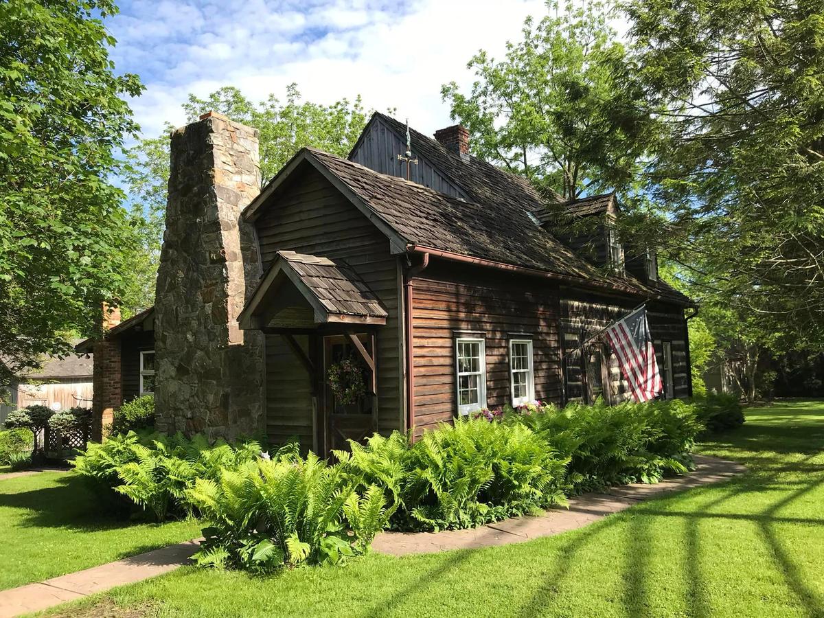 An exterior photo of the historic 1761 log house after renovation was completed. (Courtesy of Ronnie Simpson)