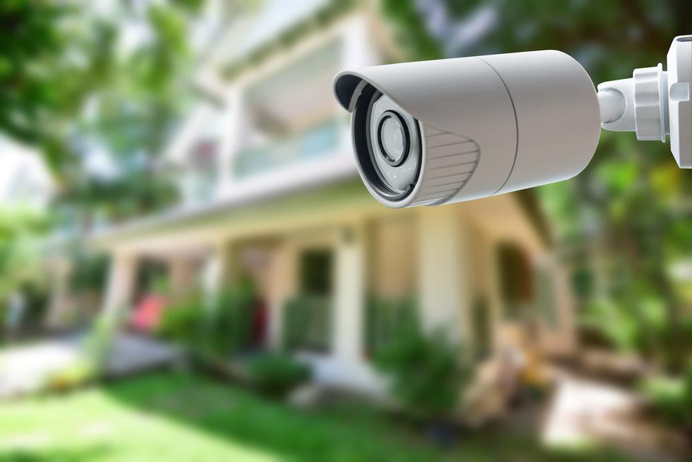 Consider installing security cameras to allow you to monitor your home even while you’re away. (Photographicss/Shutterstock)