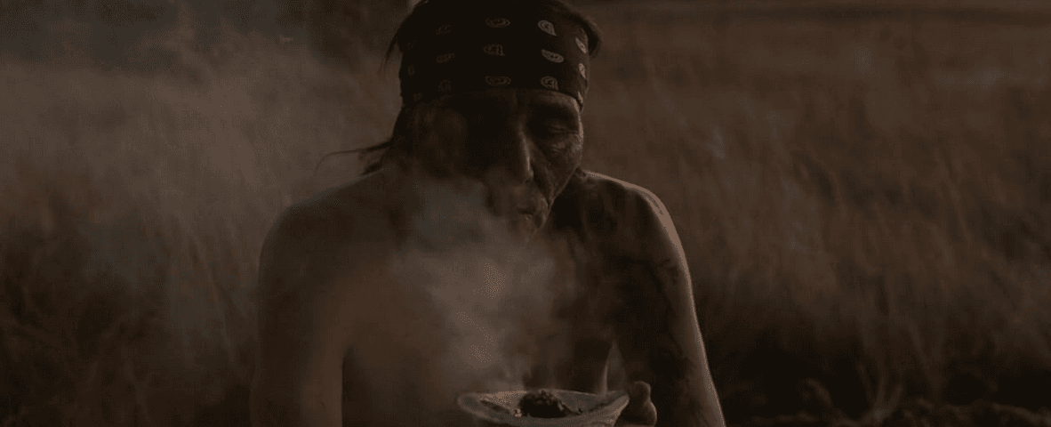 A Native elder doing a smudging ritual, in "War Pony." (Momentum Pictures)